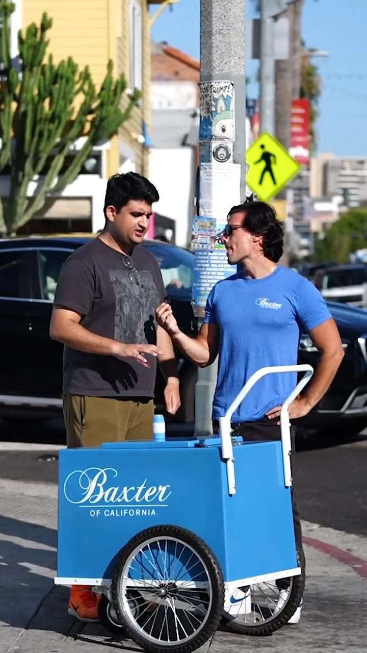 Still from the Baxter of California street-interview ad — a stranger reacting to the product on a Los Angeles sidewalk