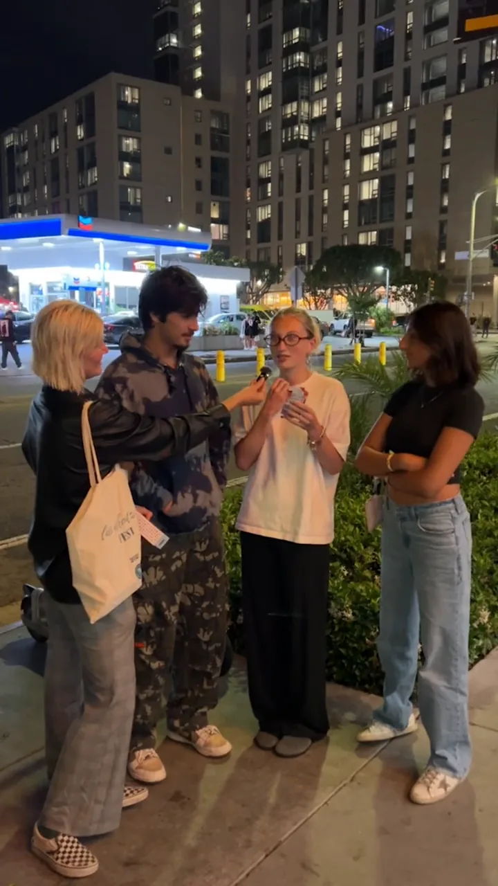 Still from the Twinkle Tongue street-interview ad — a stranger reacting to the product on a Los Angeles sidewalk